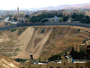 Distant view of wall - city tightly behind the wall